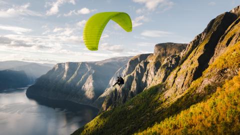 Paraglider over canyon